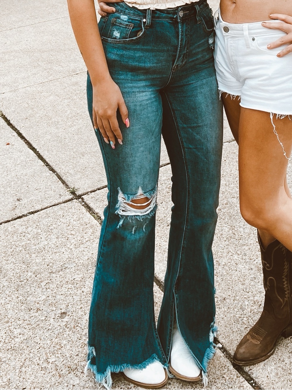 High-Rise Distressed Blue Flare Risen Jeans with Raw Split Hem